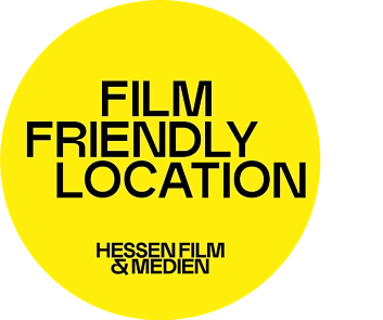 Das Label "filmfriendly location": ein großer knallgelber Kreis mit schwarzer Schrift in Großbuchstaben.&nbsp;&copy;&nbsp;Hessen Film & Medien GmbH